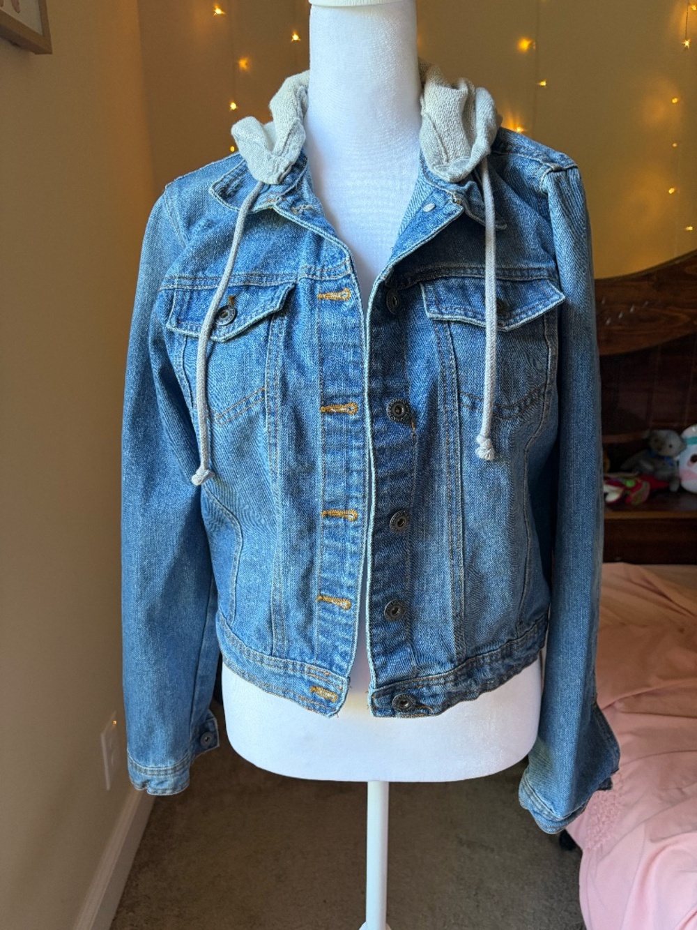 Denim jacket with gray hoodie attached
